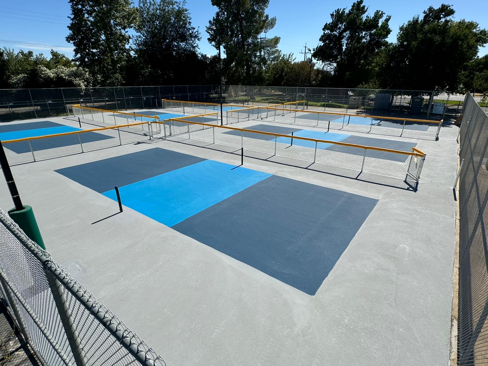 The six dedicated pickleball courts at Crawford Park with dividing fences